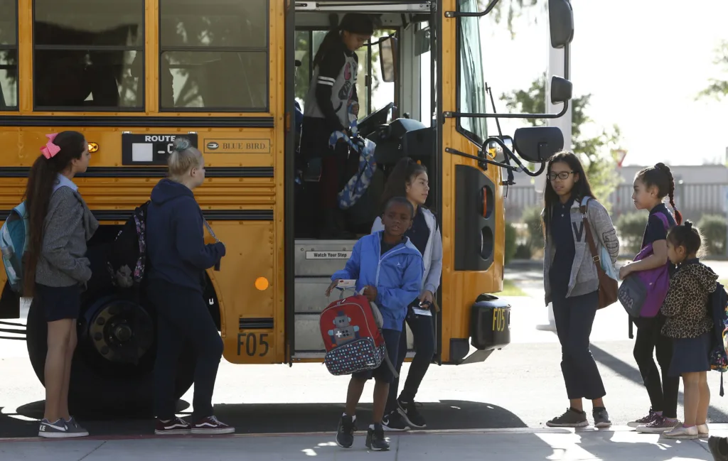 Students getting off bus